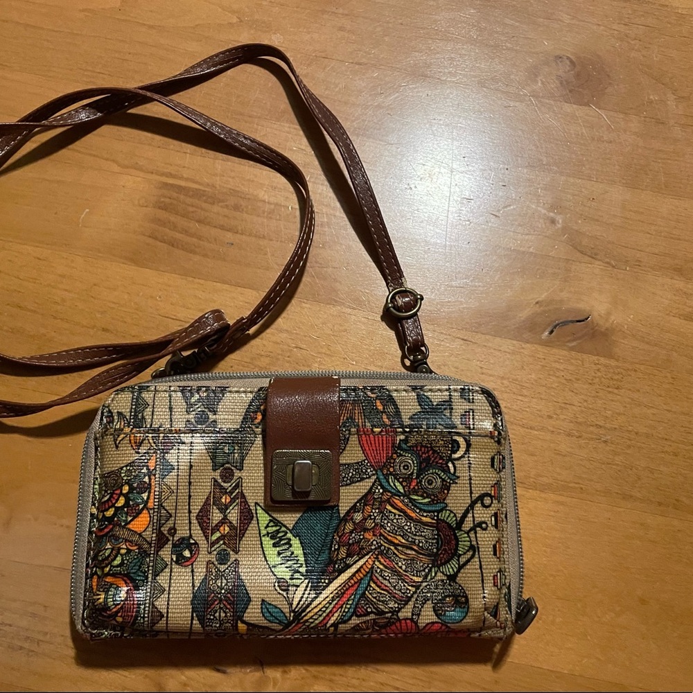 The Sak Sakroots crossbody wallet.